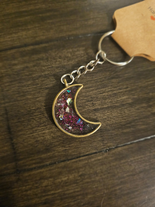 Moonlit Magic – Bronze Crescent Moon Keychain with Purple Glitter